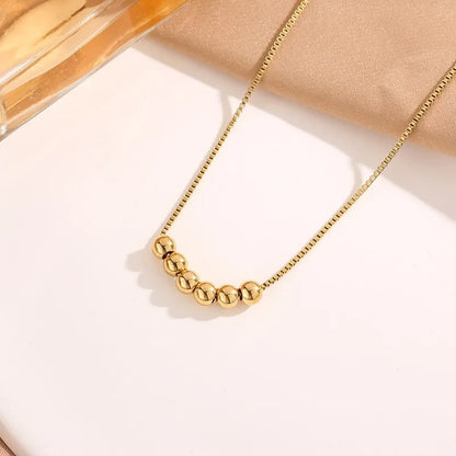 Gold Bead Pendant Necklace